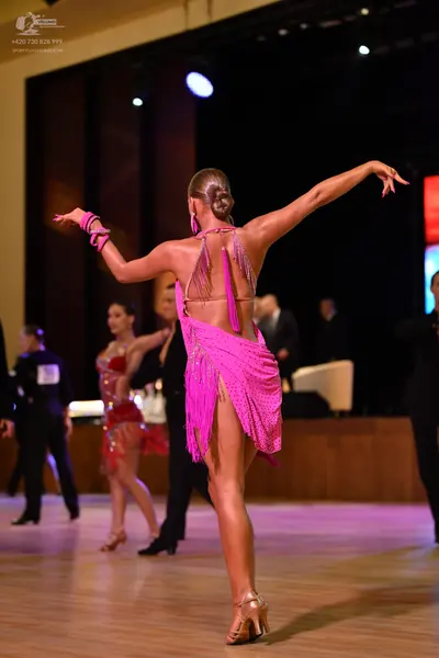 Dancesport competitor: ** Pink Latin dress