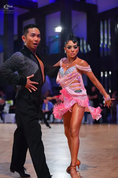 Dancesport competitor: Male dancer: black latin dance shirt with a sequin panel on the chest, black tro