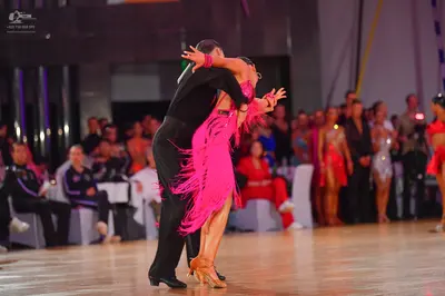 Dancesport competitor: Male dancer: black long-sleeved shirt and trousers