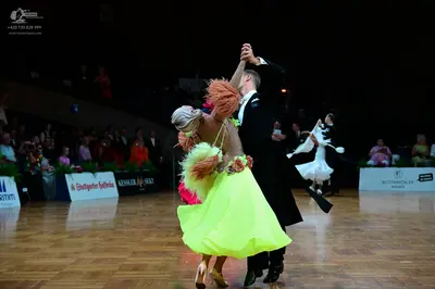 Dancesport competitor: Male dancer: black ballroom tailcoat suit with a white shirt and black trousers