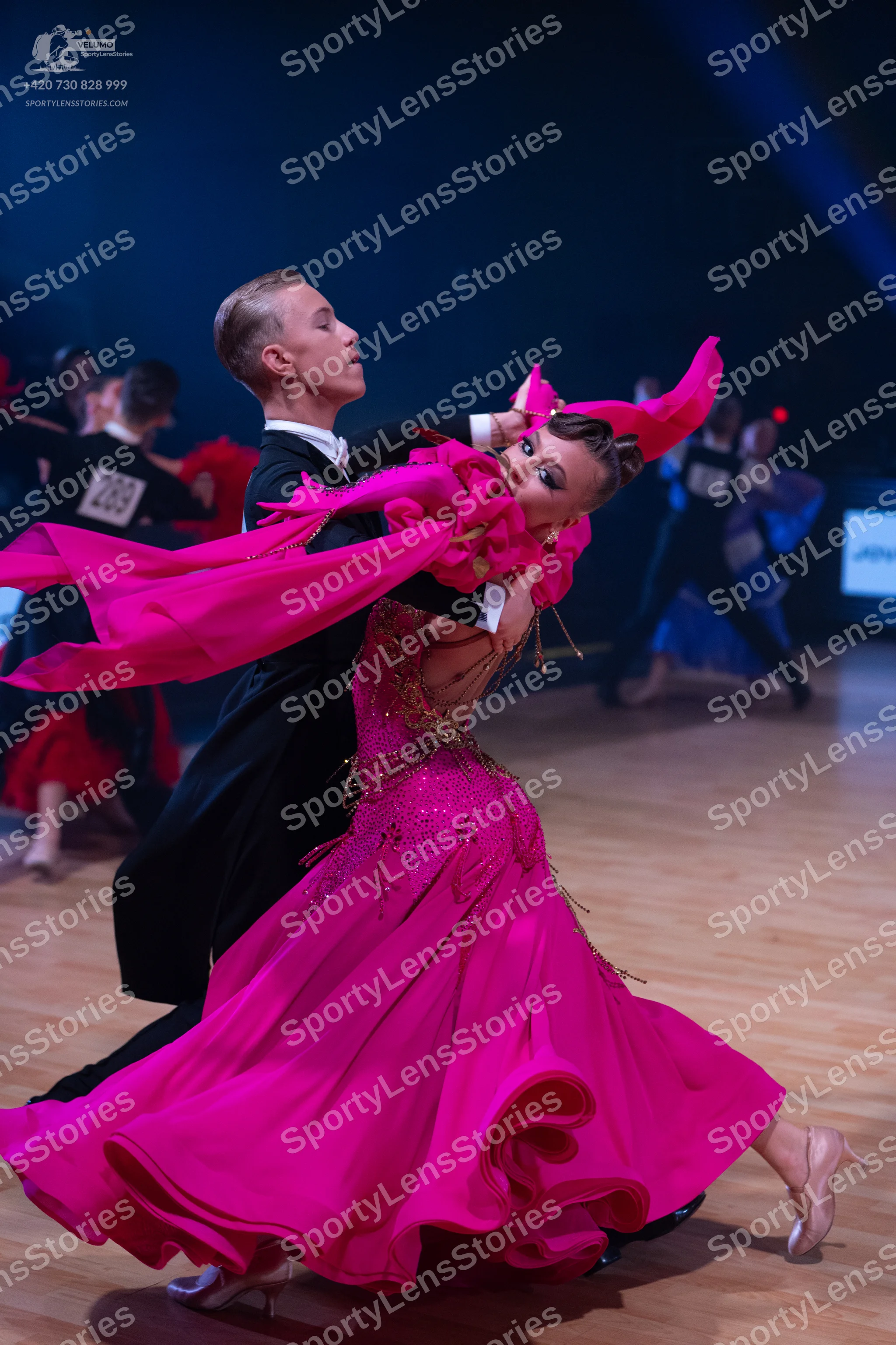 Dancesport competitor: Male dancer: black suit with white shirt