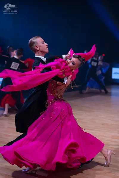 Dancesport competitor: Male dancer: black suit with white shirt