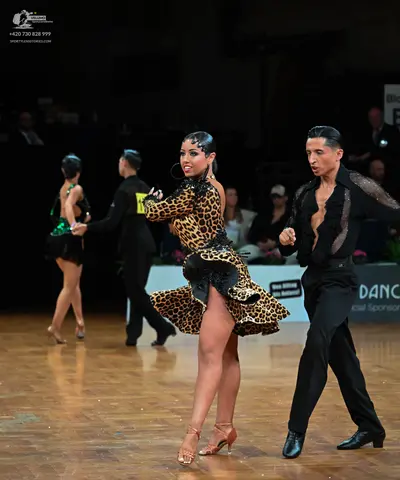 Dancesport competitor: Male dancer: black long-sleeved shirt with sequin pattern on the chest and black