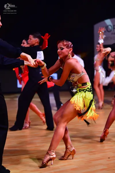 Dancesport competitor: Male dancer: black long-sleeved shirt and black trousers