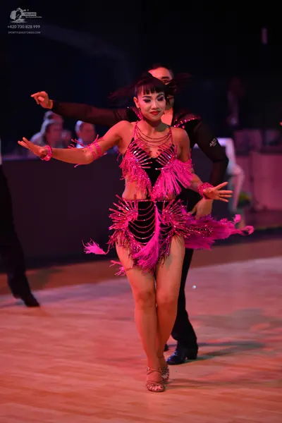Dancesport competitor: Male dancer: black long-sleeved shirt and black trousers