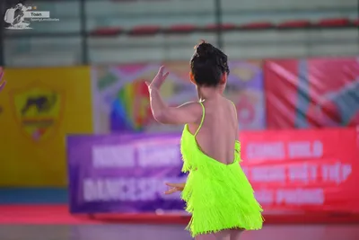 Dancesport competitor: ** Bright Yellow (Neon) fringed halter top and skirt