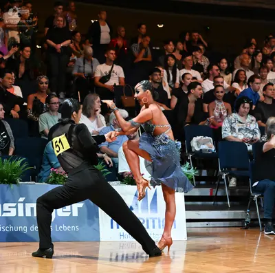 Dancesport competitor #51: Male dancer: black long-sleeved shirt and black trousers