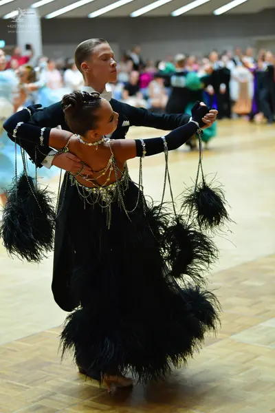 Dancesport competitor: Male dancer: black suit