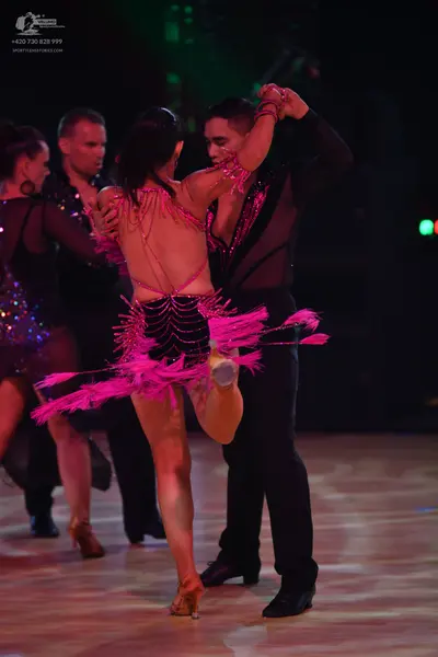 Dancesport competitor: Female dancer: black sequin latin dress