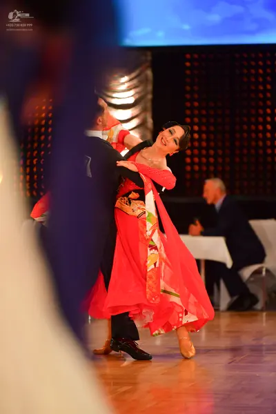 Dancesport competitor: Male dancer: black suit with white shirt