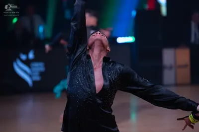 Dancesport competitor: Male dancer: black long-sleeved satin-like shirt with small scattered sequins, u