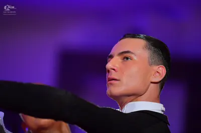 Dancesport competitor: Male dancer: black suit with a white shirt