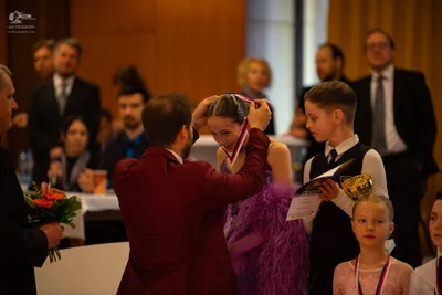 Dancesport competitor: Female dancer: purple latin dress with fringe