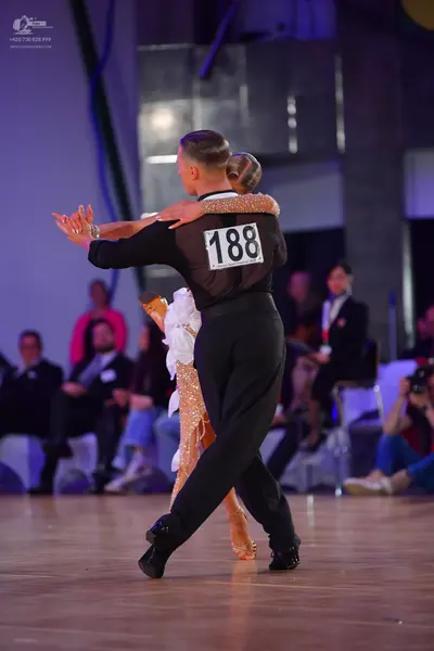 Dancesport competitor #188: Male dancer: black long-sleeved shirt and black trousers