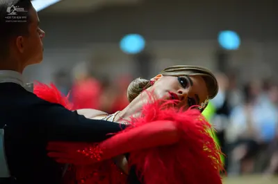 Dancesport competitor: Male dancer: black long-sleeved top