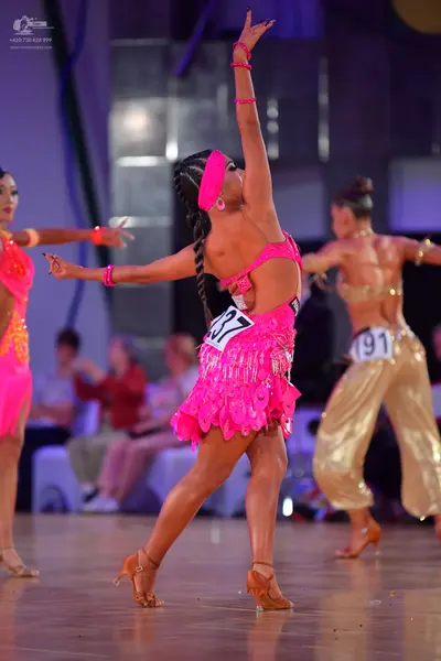 Dancesport competitor #37, #191: Female dancer: pink latin dress with orange/yellow sequins