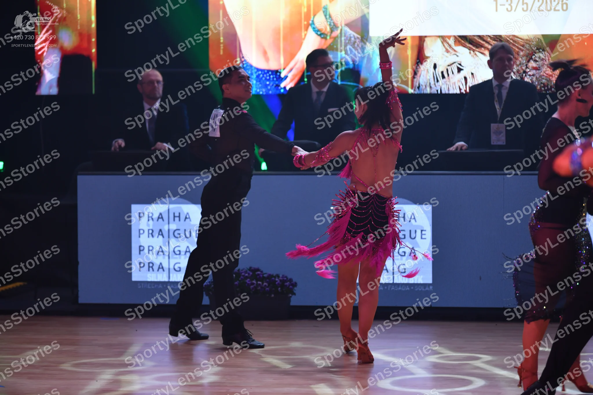 Dancesport competitor: Male dancer: black long-sleeved shirt and black trousers