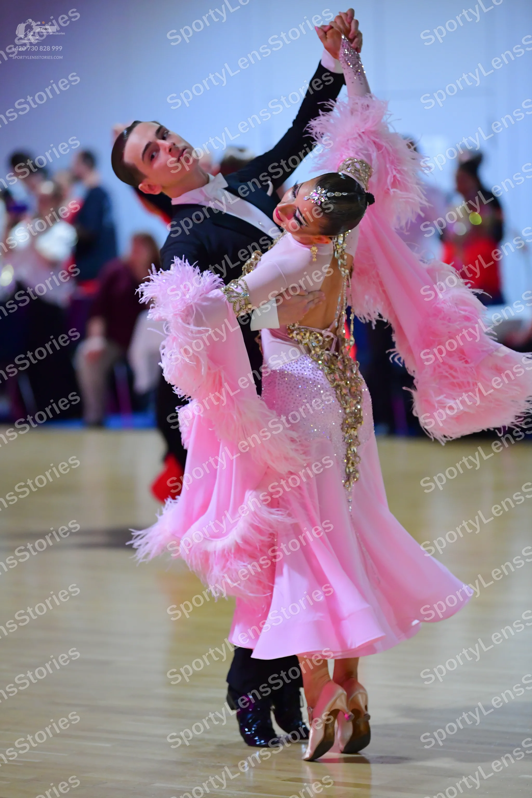 Dancesport competitor: Male dancer: black suit with a white shirt and a black bow tie