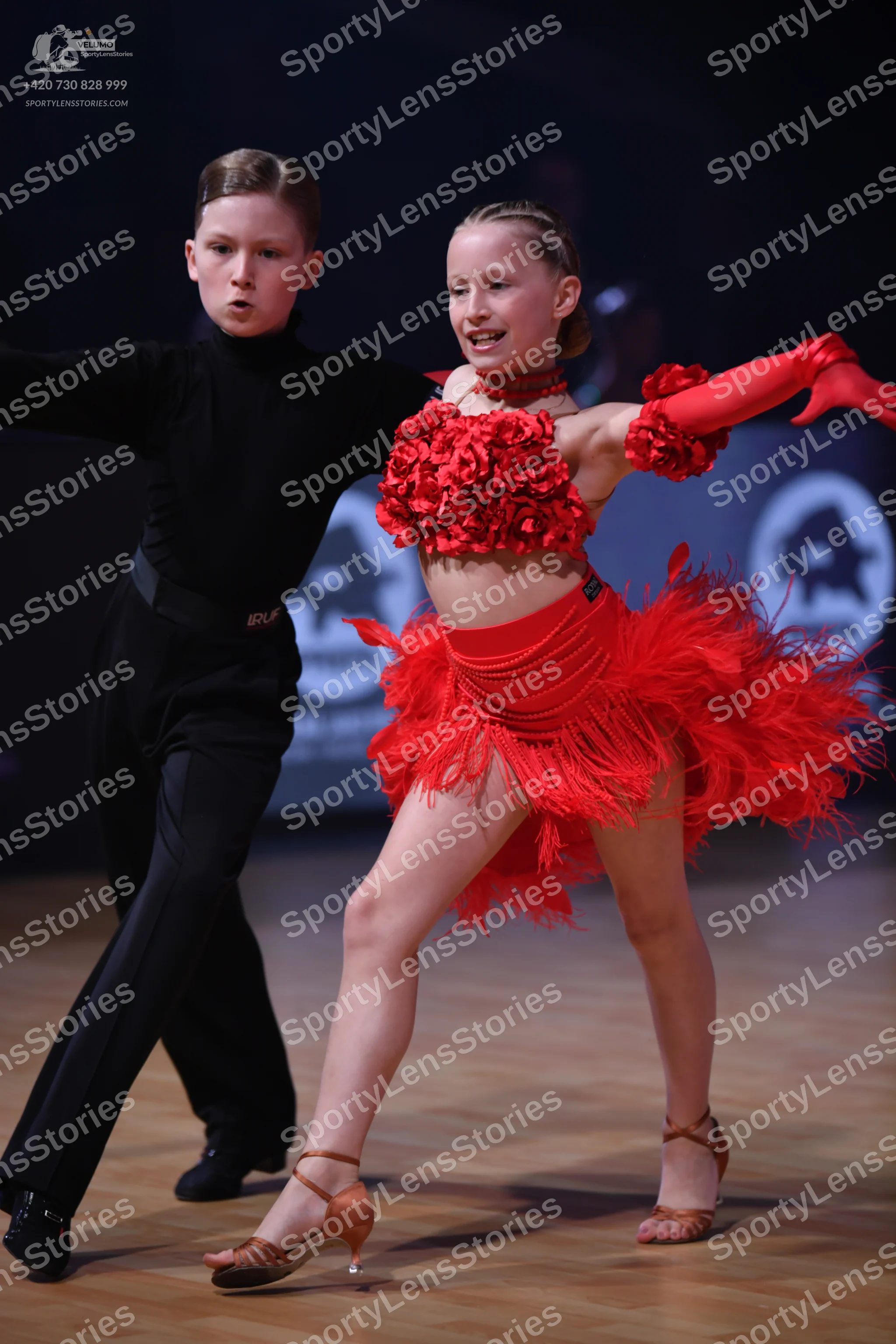 Dancesport competitor: Male dancer: black long-sleeved top and trousers