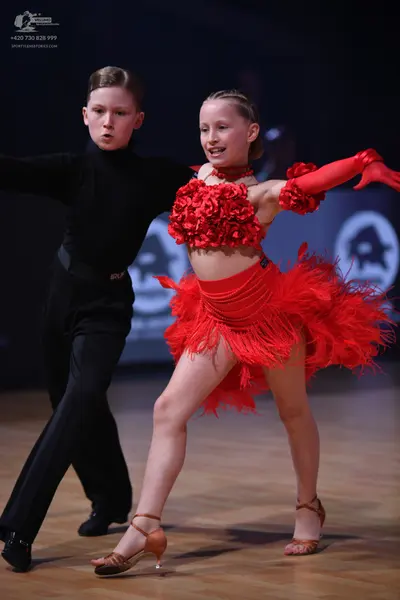 Dancesport competitor: Male dancer: black long-sleeved top and trousers