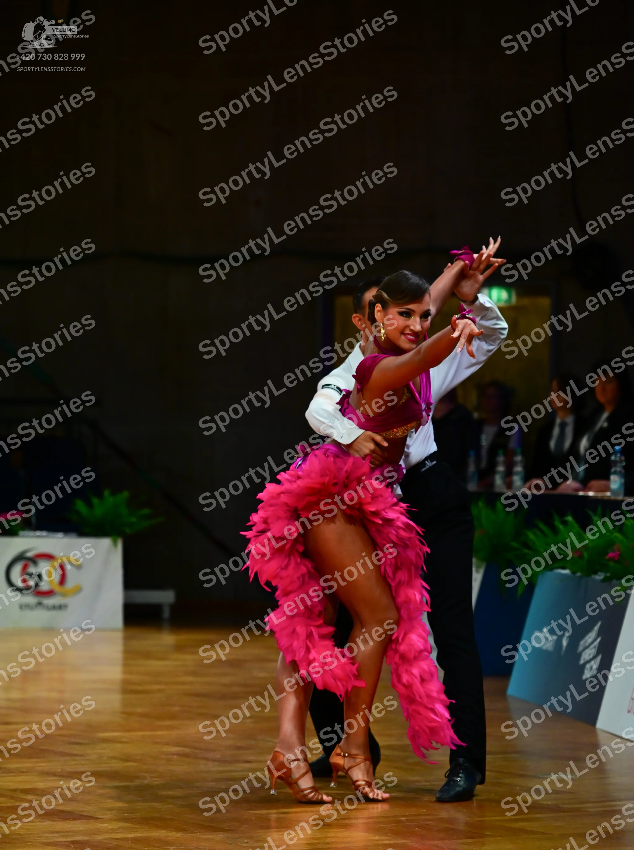 Dancesport competitor: Male dancer: white long-sleeved shirt and black trousers