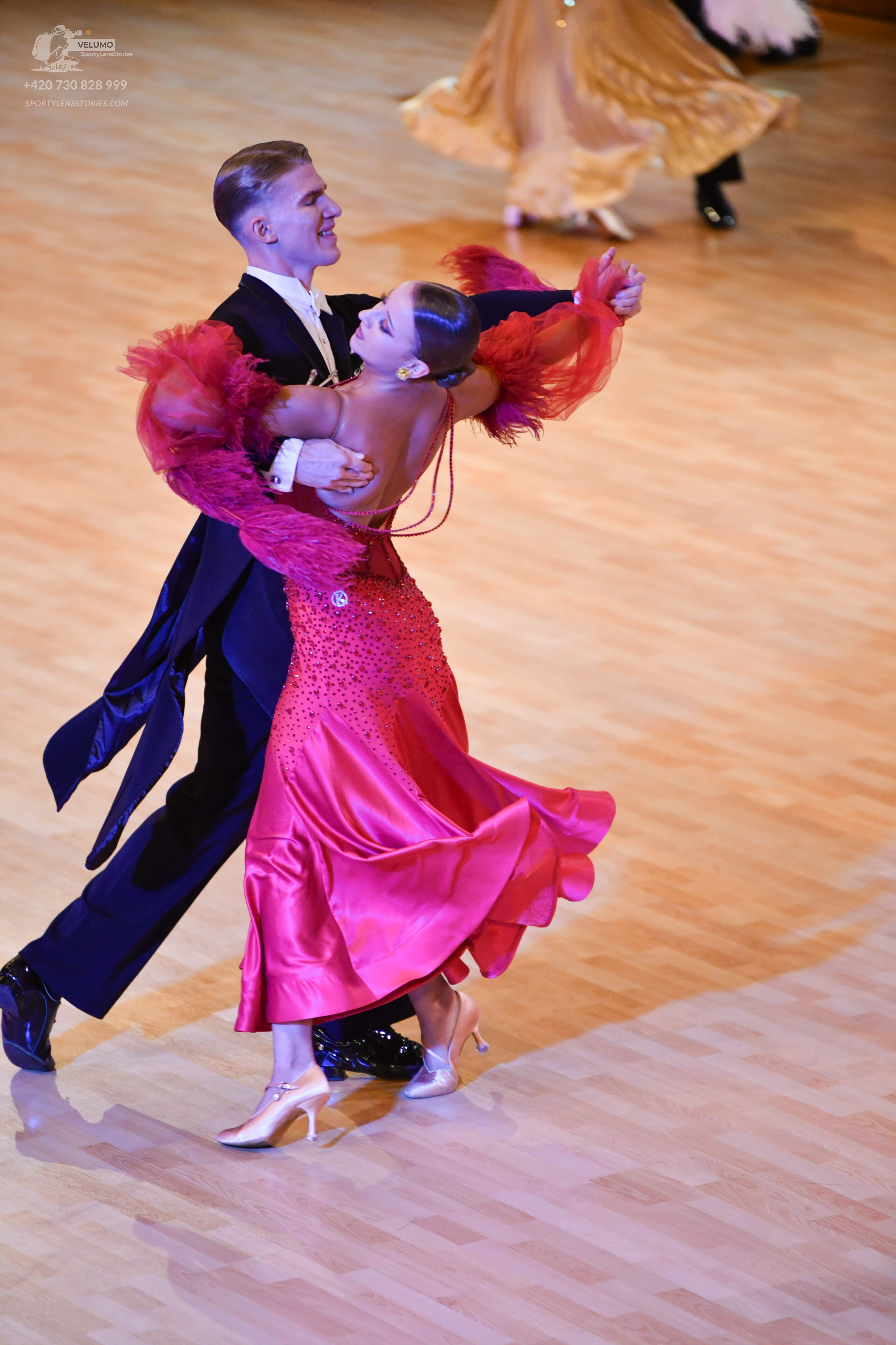 Dancesport competitor: ** Black tail suit
*   **Fabric:** Likely satin or a similar smooth fabric based