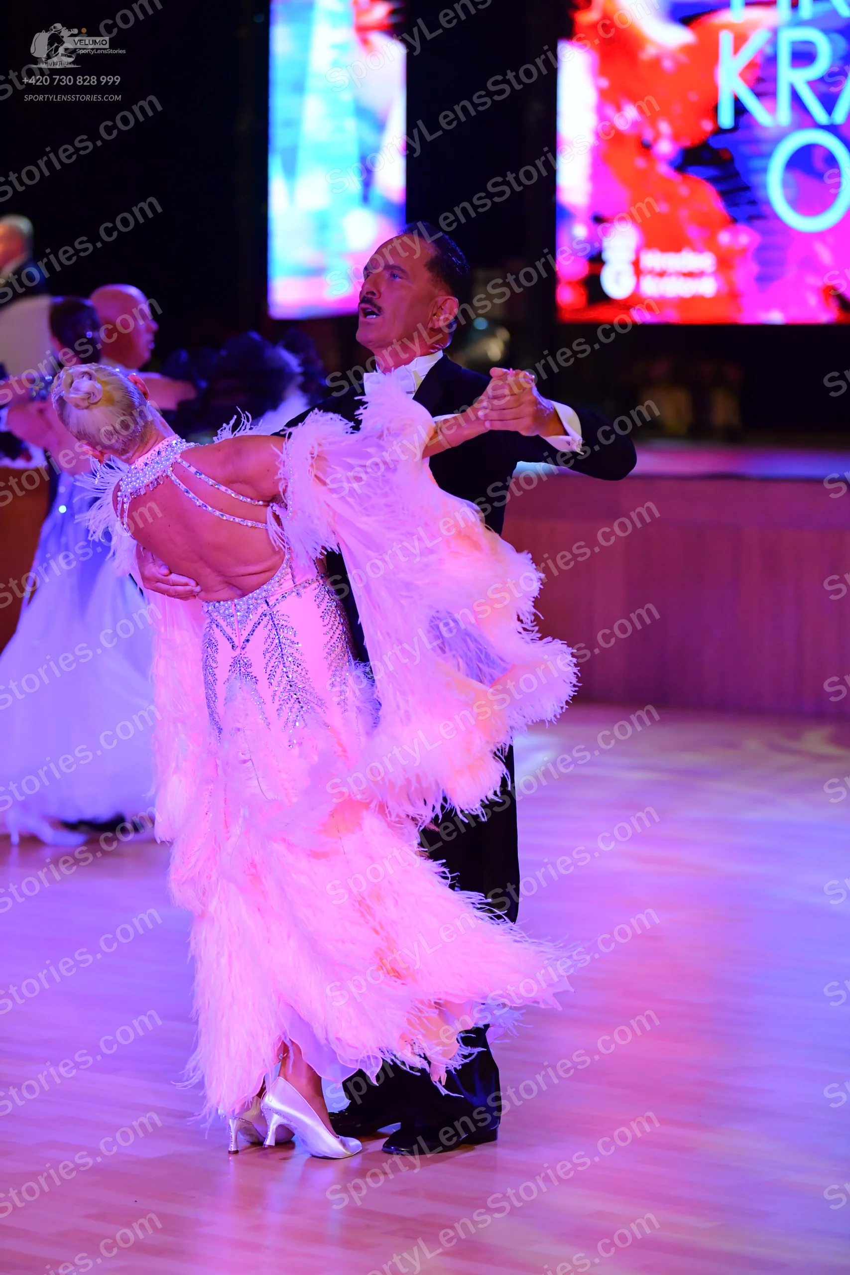 Dancesport competitor: ** Black suit with a satin jacket and matching trousers