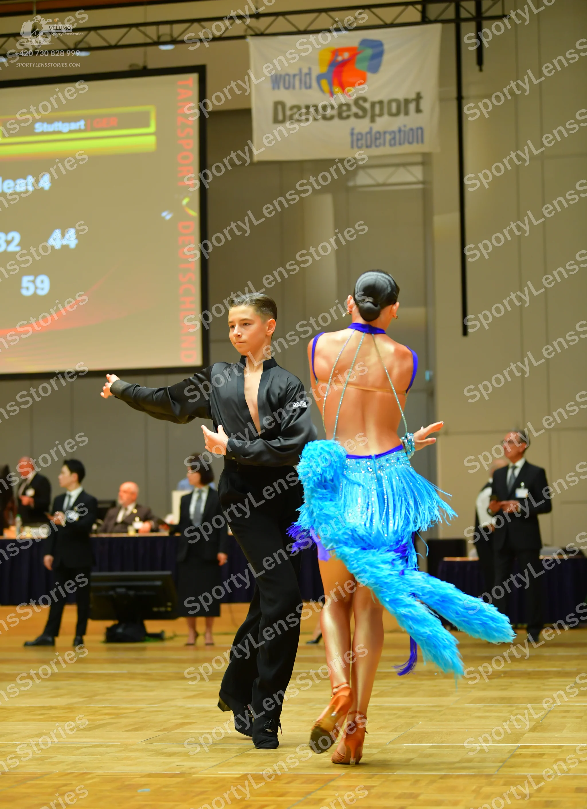 Dancesport competitor: Male dancer: black long-sleeved shirt and black trousers