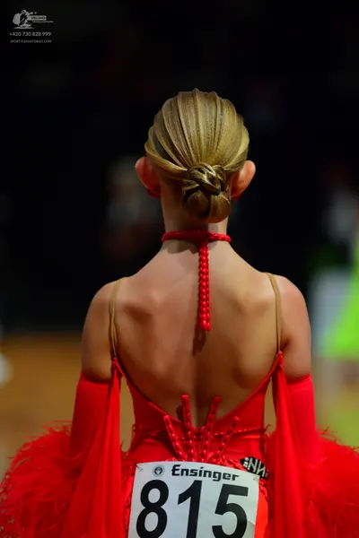 Dancesport competitor #815: Female dancer: red latin dress with feather-like detailing