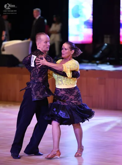 Dancesport competitor: ** Black suit with a subtle sequin detailing on the lapels