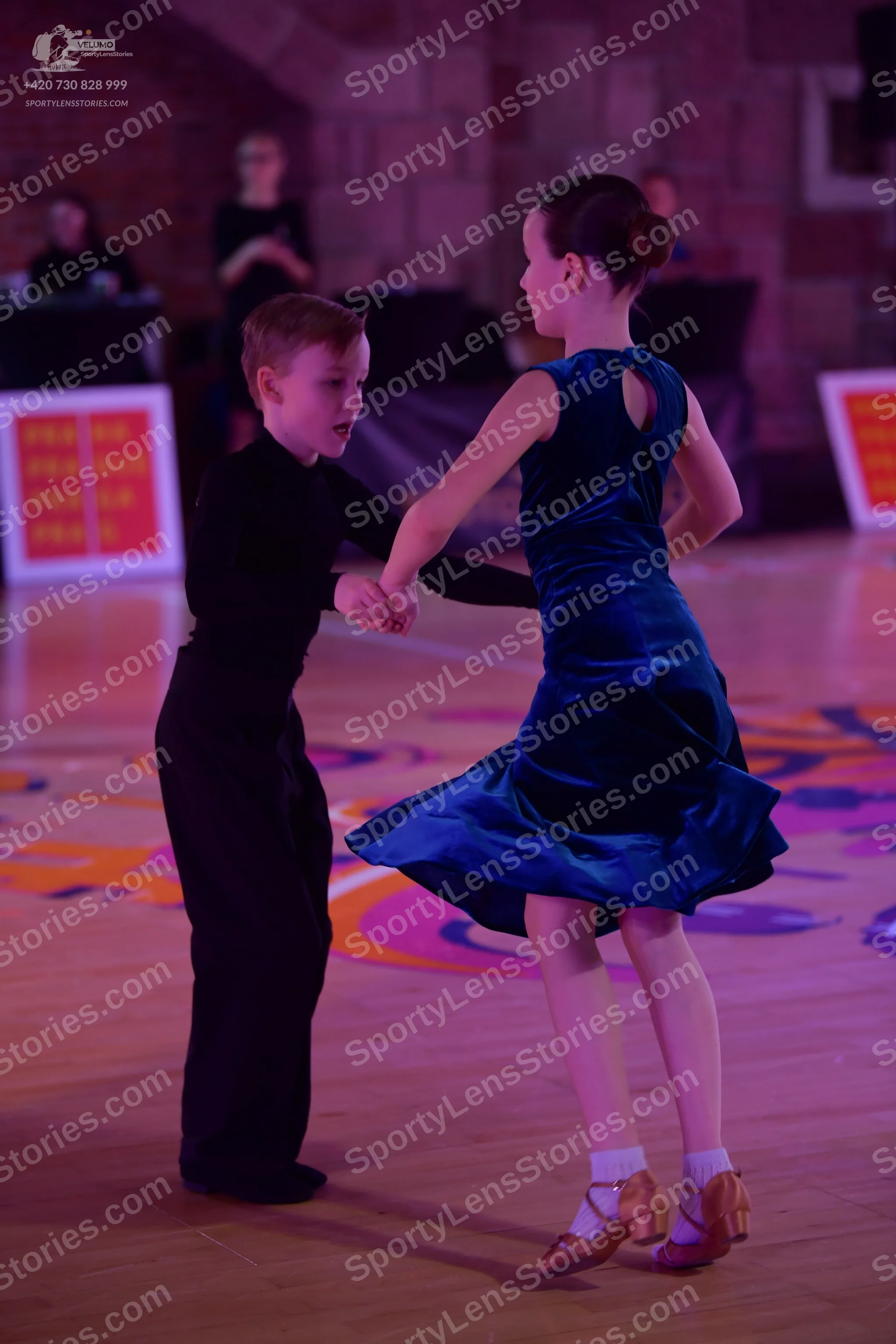Dancesport competitor: Male dancer: black long-sleeved top and black trousers