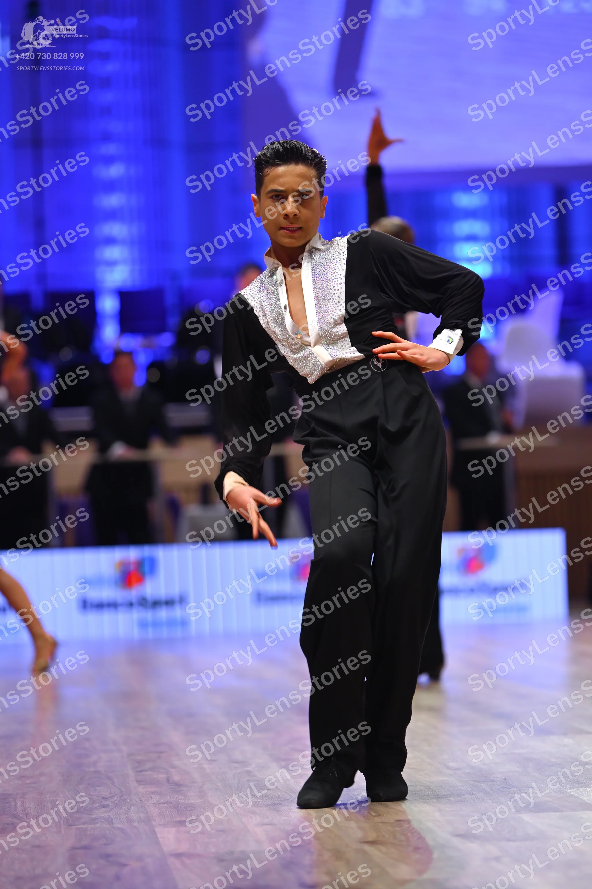 Dancesport competitor: Male dancer: black and white Latin dance shirt with a textured or sequined white