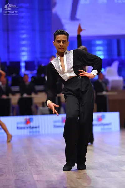 Dancesport competitor: Male dancer: black and white Latin dance shirt with a textured or sequined white