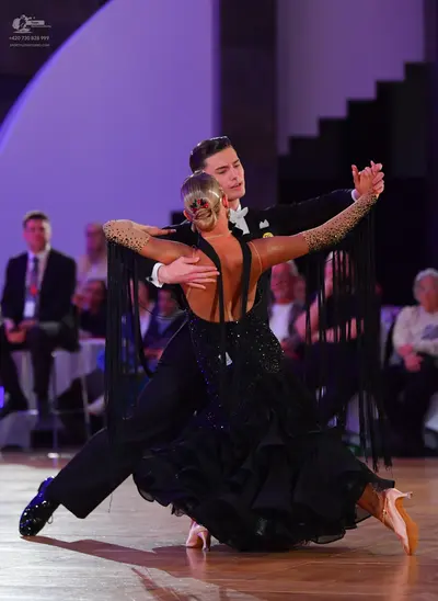 Dancesport competitor: Male dancer: black suit