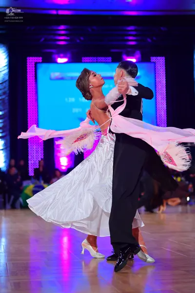 Dancesport competitor: Male dancer: black suit and black dance shoes