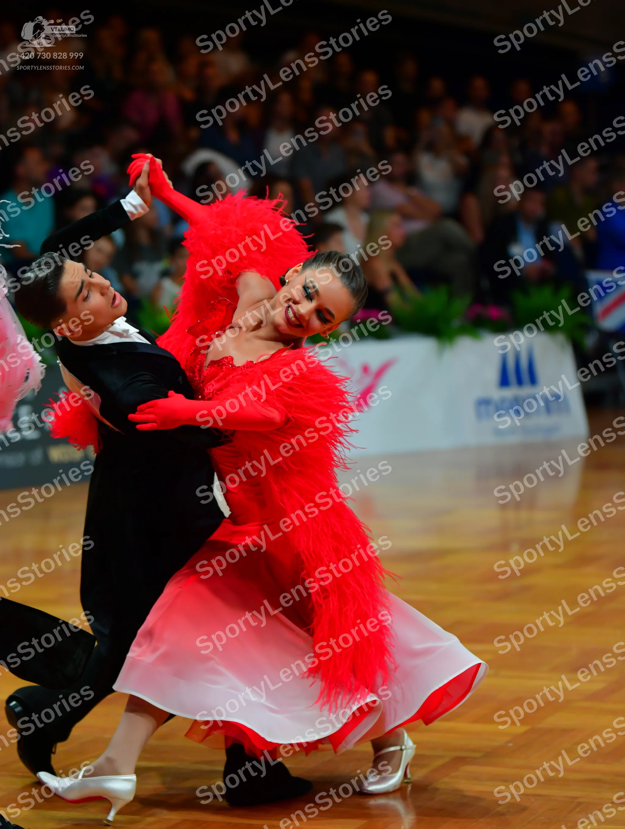 Dancesport competitor: Male dancer: black suit with a white shirt
