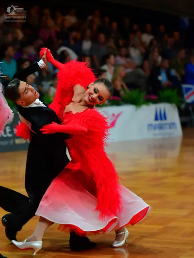 Dancesport competitor: Male dancer: black suit with a white shirt