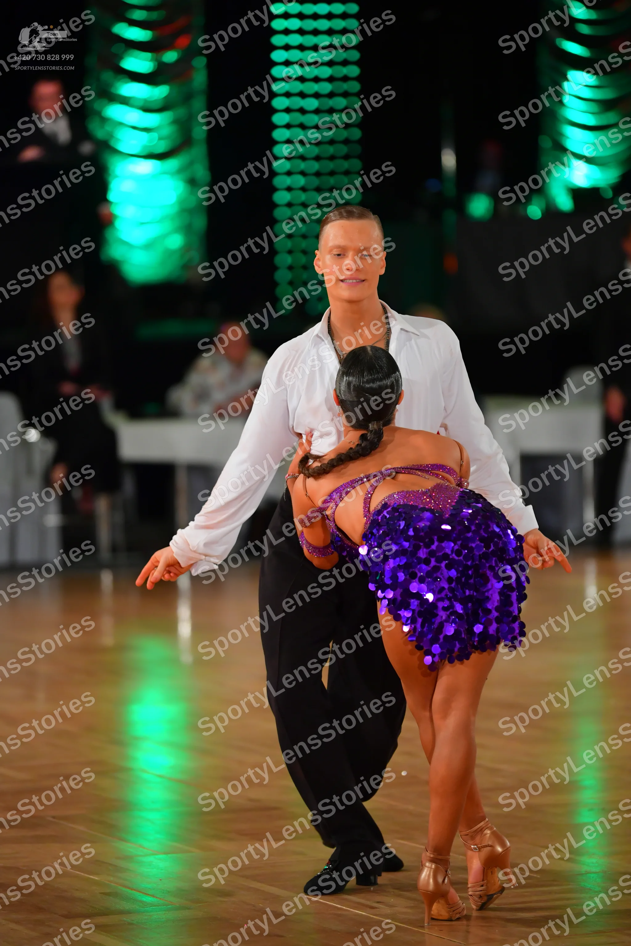Dancesport competitor: Male dancer: white long-sleeved shirt and black trousers