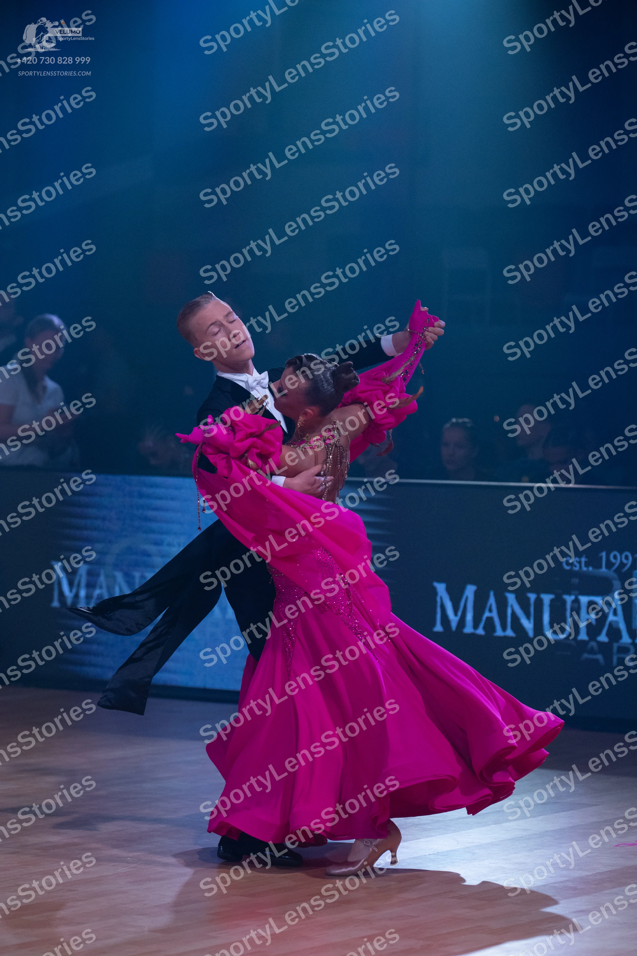 Dancesport competitor: Male dancer: black suit with a white shirt and white bow tie