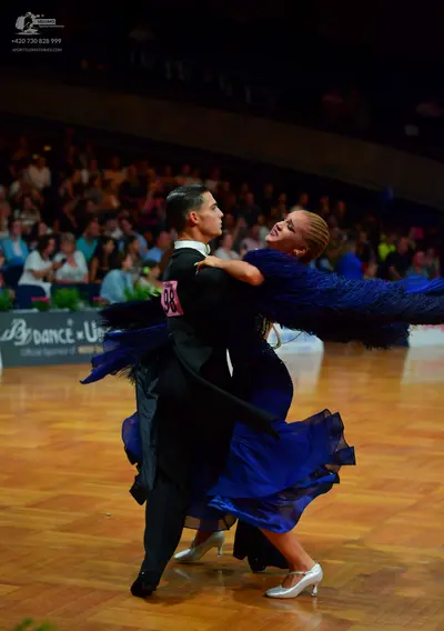 Dancesport competitor: Male dancer: black tailcoat, white shirt, and black trousers