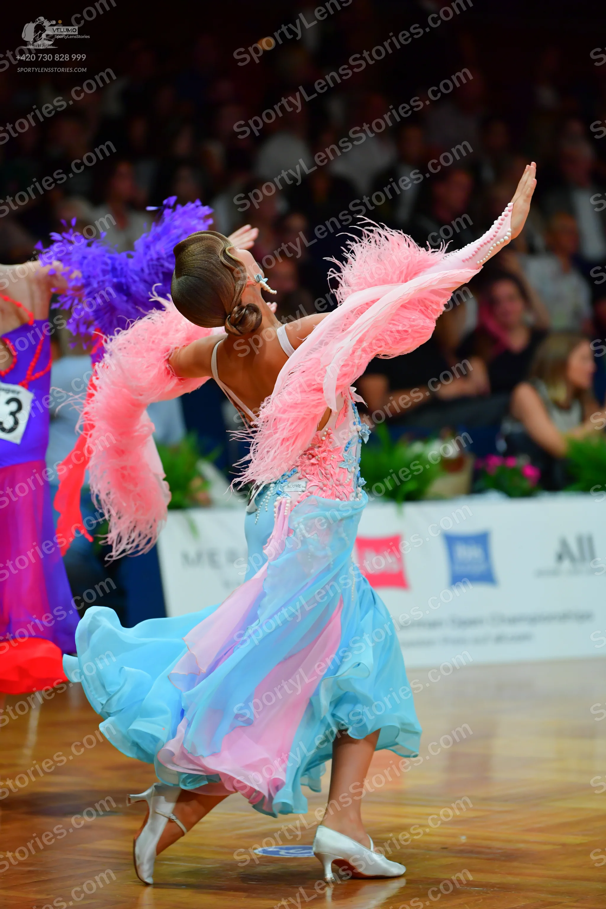 Dancesport competitor: Female dancer 1: purple and magenta latin dress