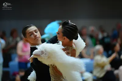 Dancesport competitor: Male dancer: black suit