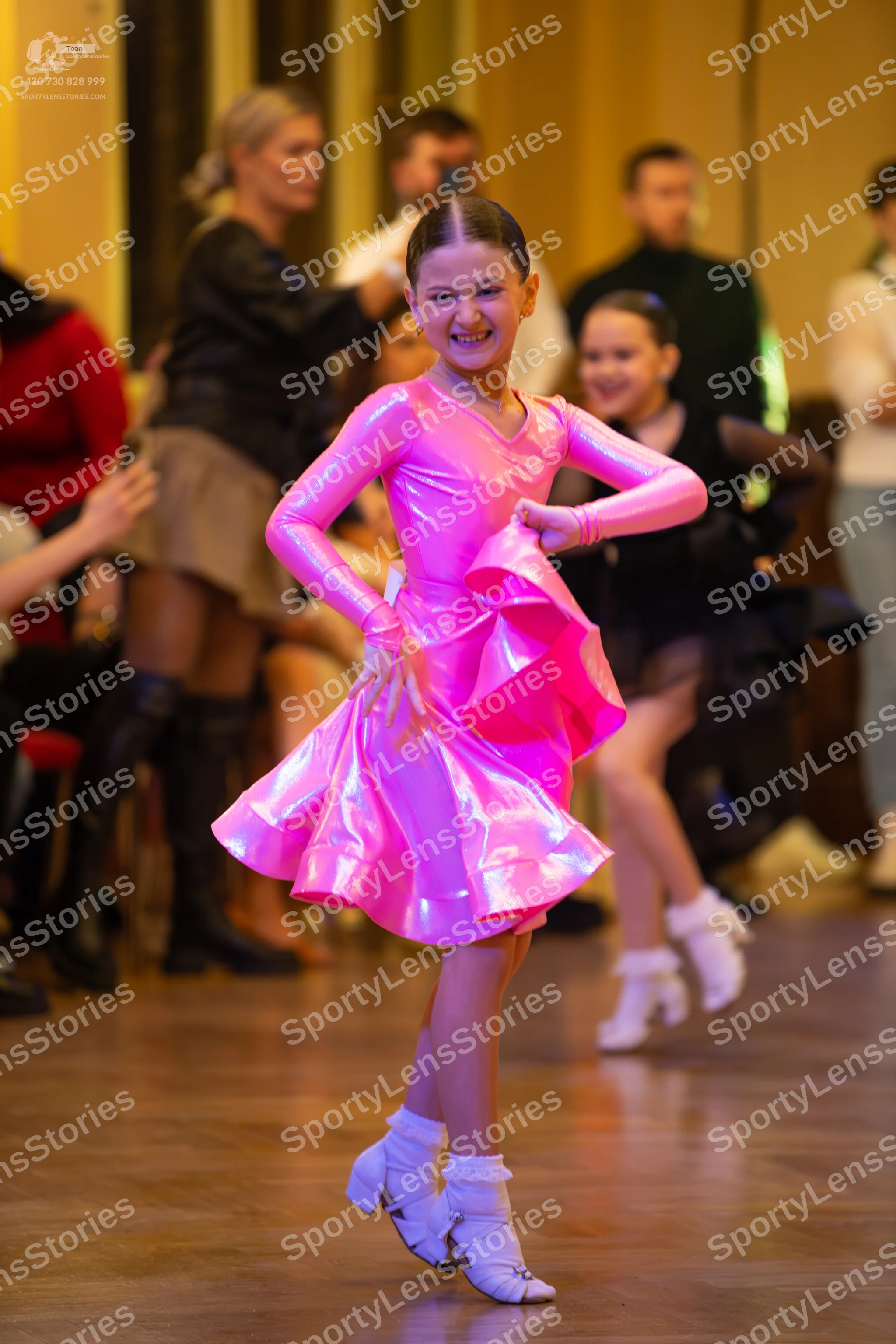 Dancesport competitor: ** Female: Bright, hot pink, bodycon latin dress