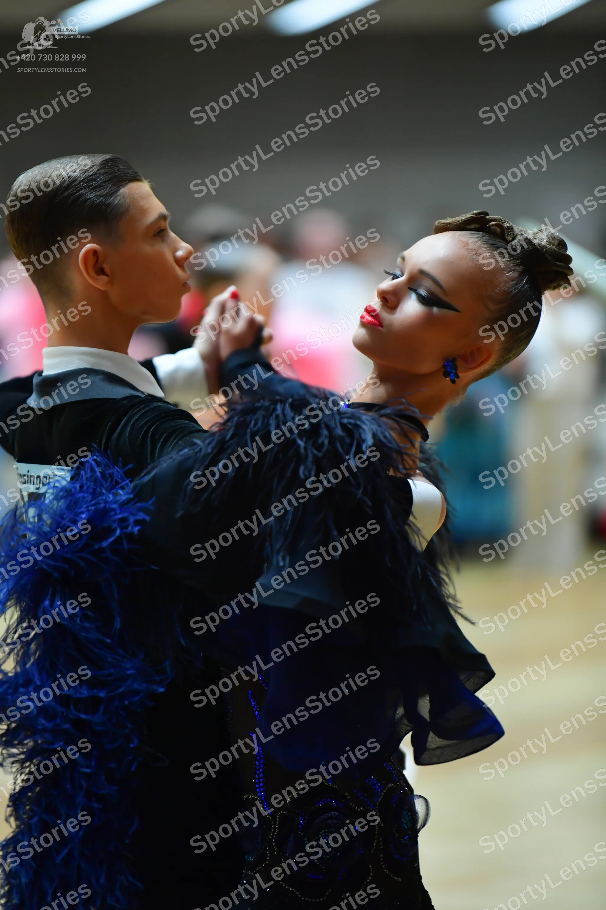 Dancesport competitor: Male dancer: black shirt with a white collar