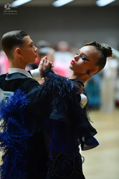 Dancesport competitor: Male dancer: black shirt with a white collar