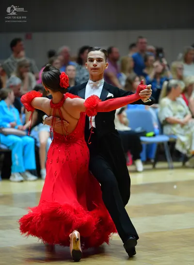 Dancesport competitor: Male dancer: black suit with a white shirt