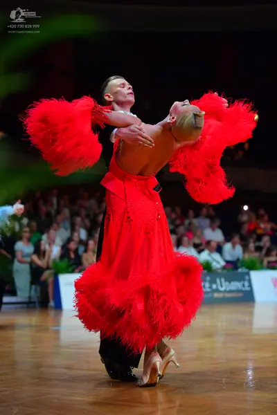 Dancesport competitor: Male dancer: black suit with a white shirt