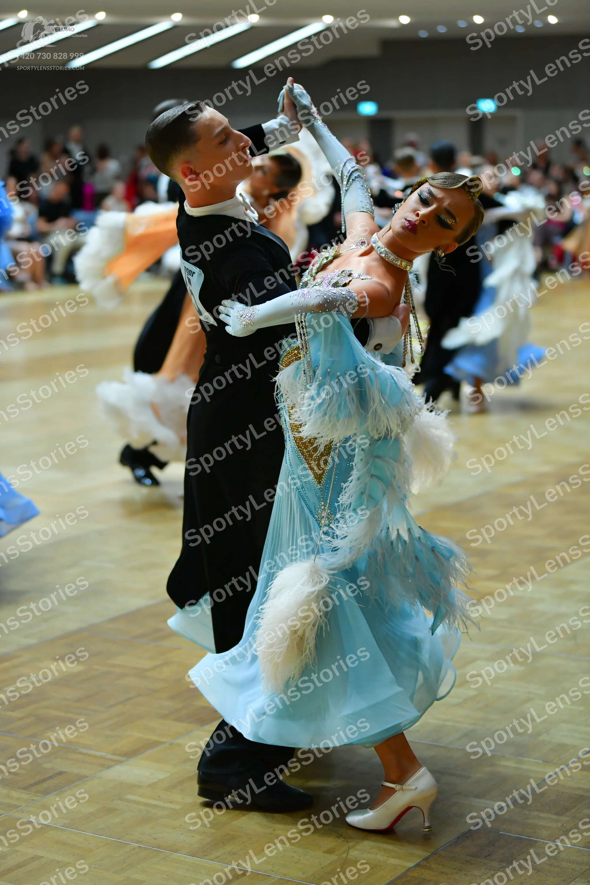 Dancesport competitor: Male dancer: black long-sleeved suit
