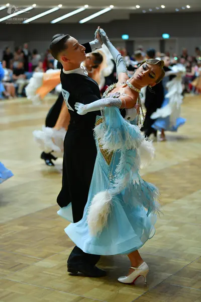 Dancesport competitor: Male dancer: black long-sleeved suit