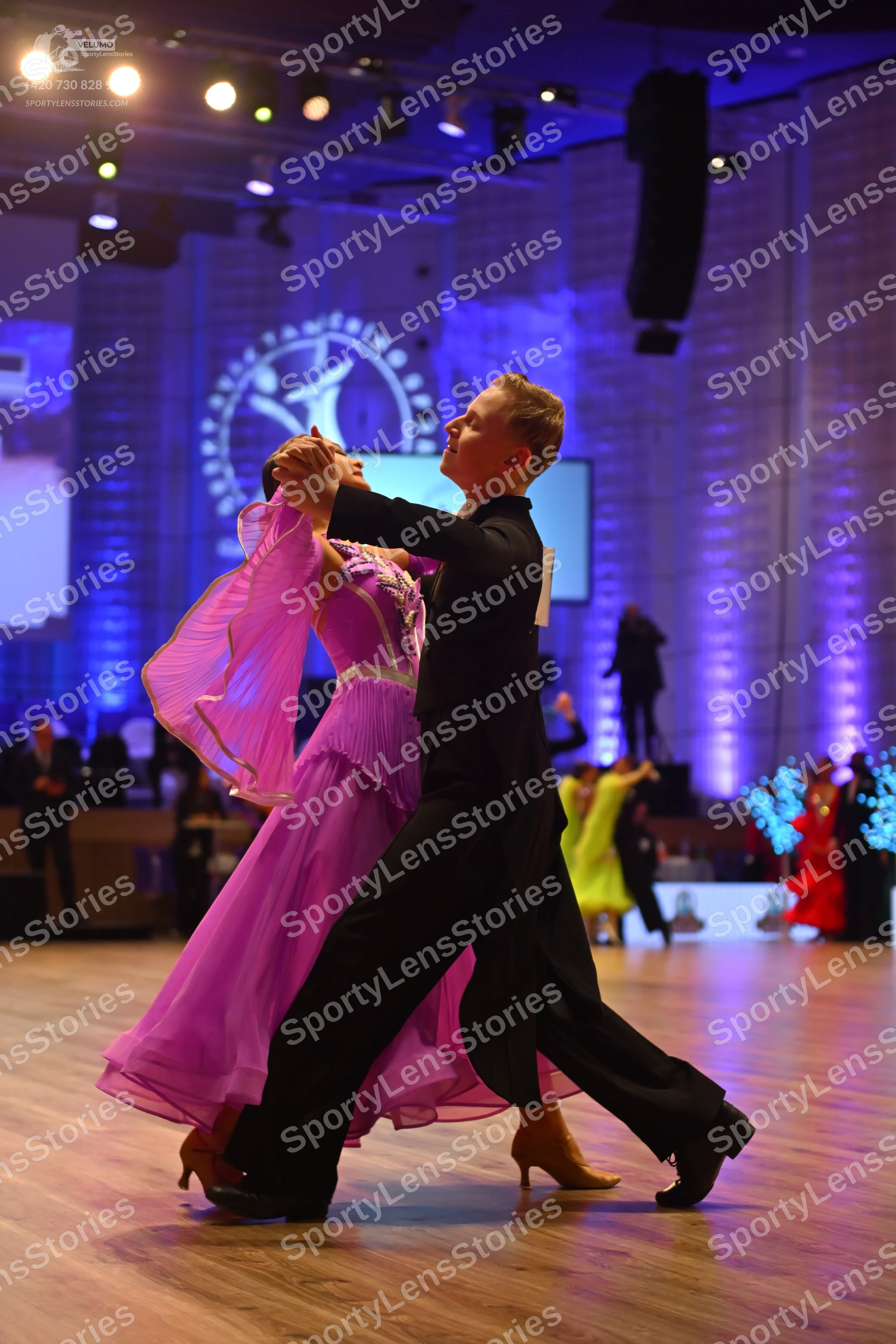 Dancesport competitor: Male dancer: black ballroom suit